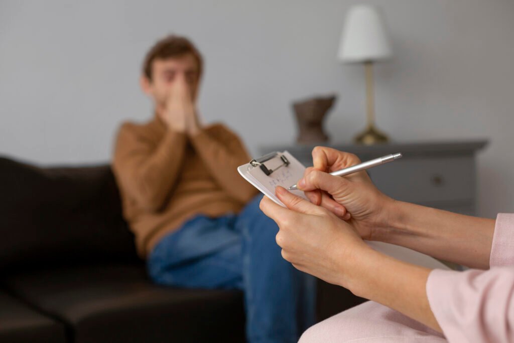 Therapist taking notes during session illustrating Starting Depression Therapy What to Expect process