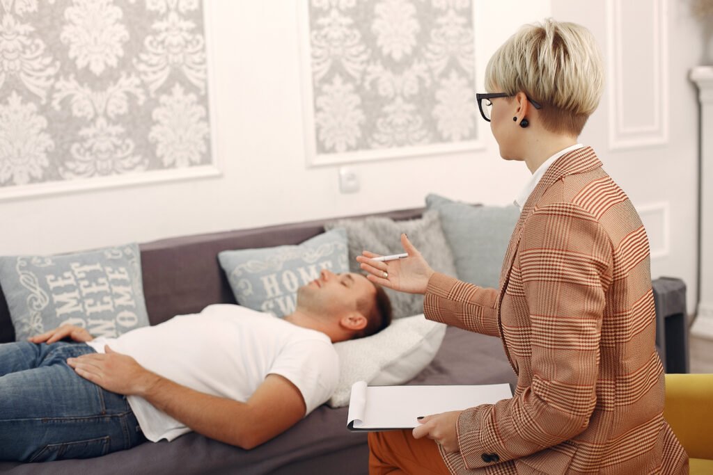 Man discussing emotional stress and hidden anxiety symptoms with a therapist during a counseling session