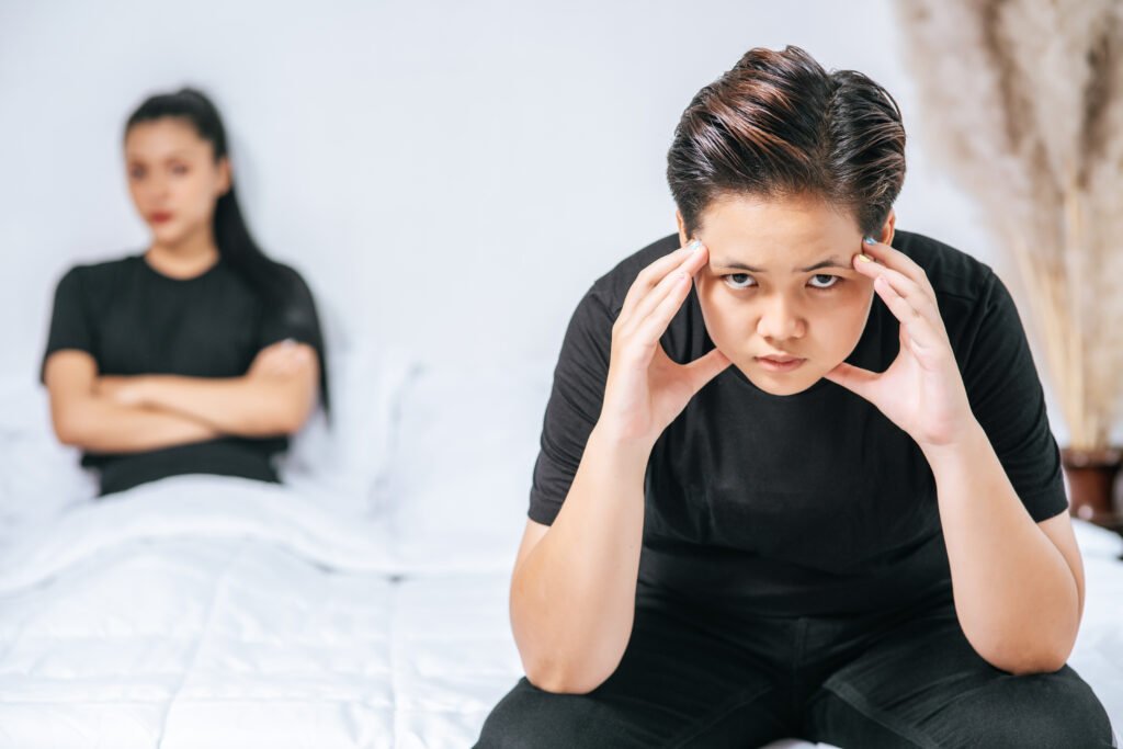 Parent and child sitting apart emotionally during family conflict and relationship struggles